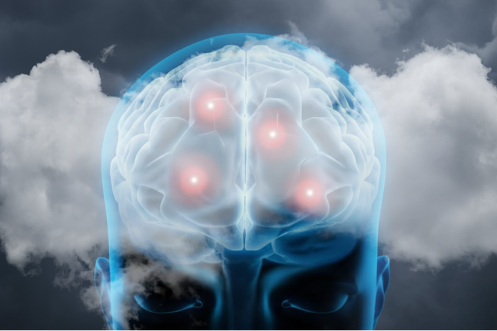 Illustration of a blue, glowing brain with red, glowing spots, representing inflammatory activity and the disruptions alcohol causes in the brain