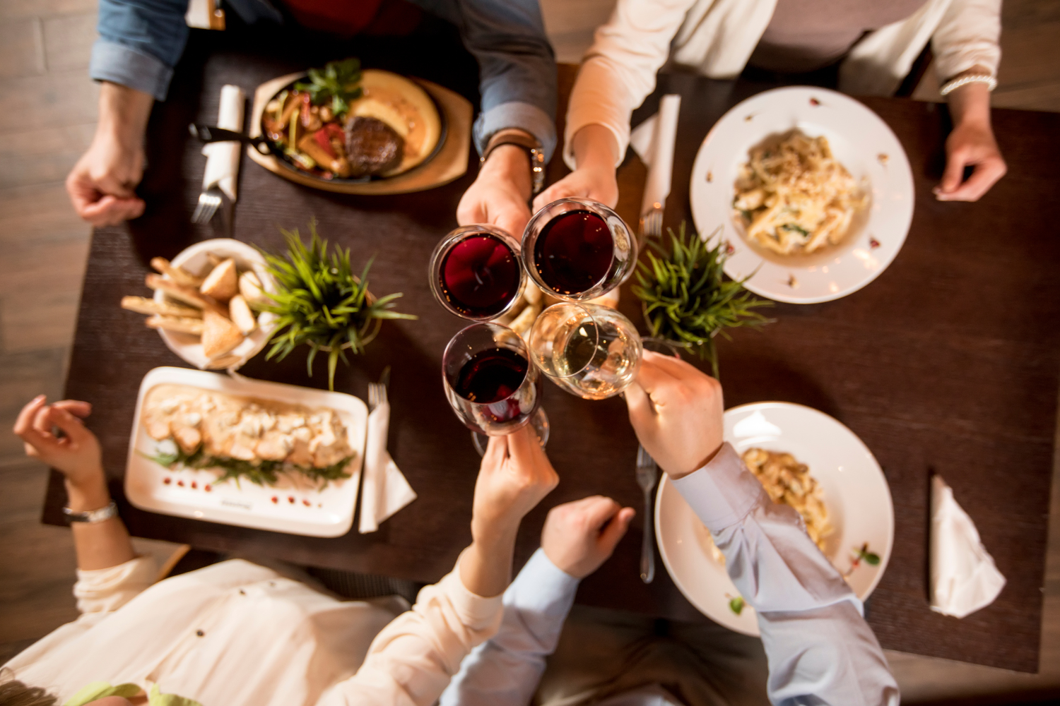 Group of people toasting glasses of wine